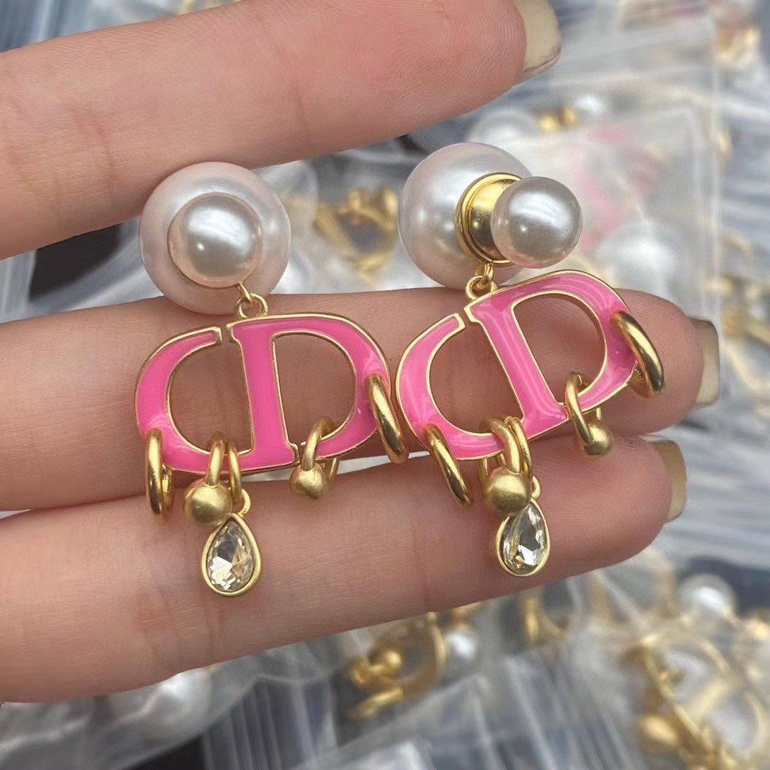 Boucles d'oreilles CD en or rose et perle avec 1 diamant