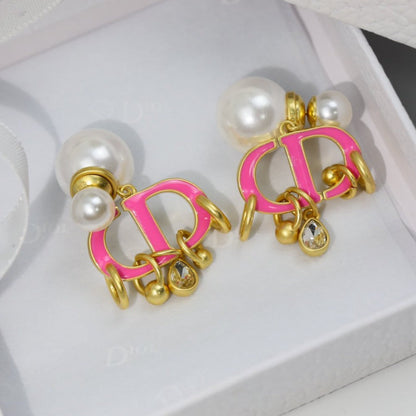 Boucles d'oreilles CD en or rose et perle avec 1 diamant