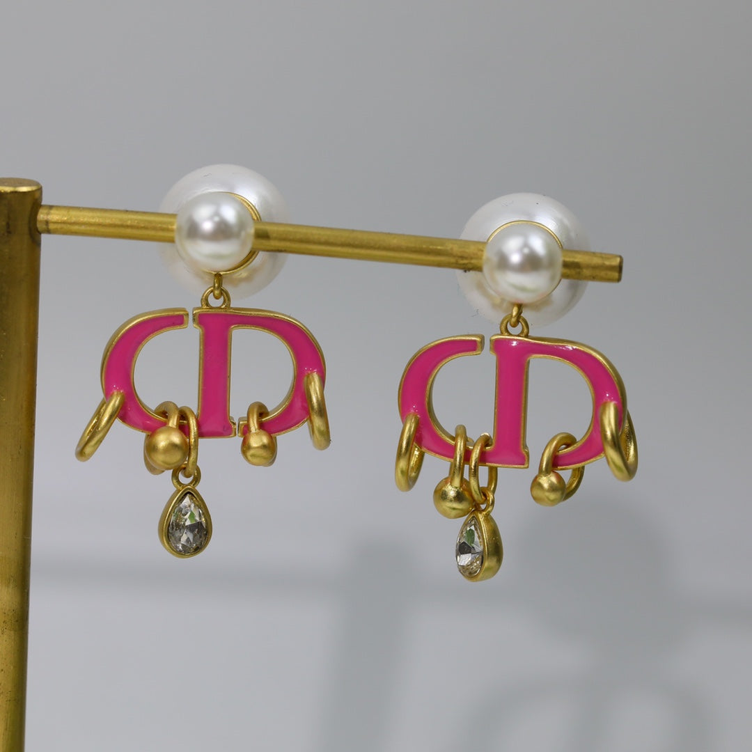 Boucles d'oreilles CD en or rose et perle avec 1 diamant