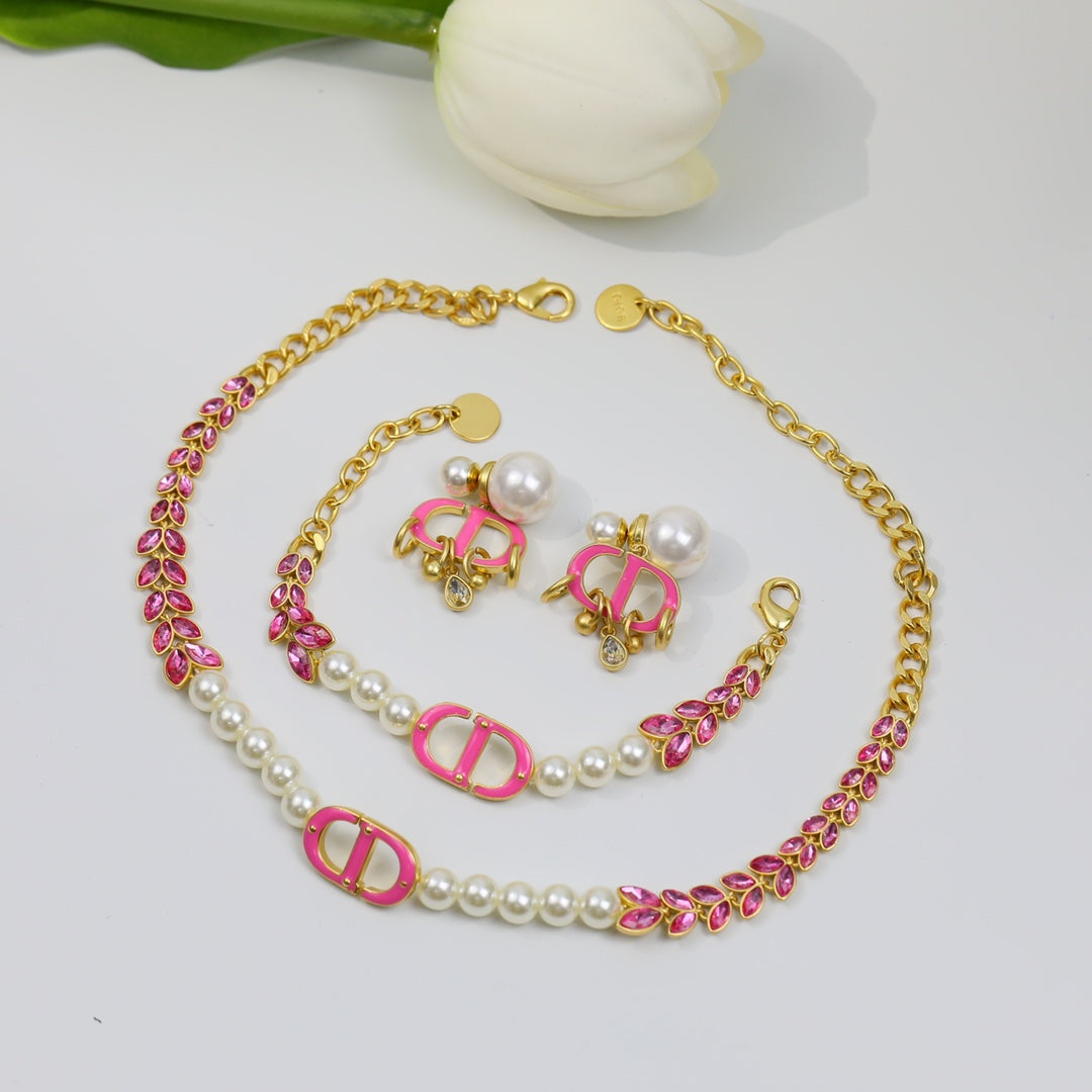 Boucles d'oreilles CD en or rose et perle avec 1 diamant
