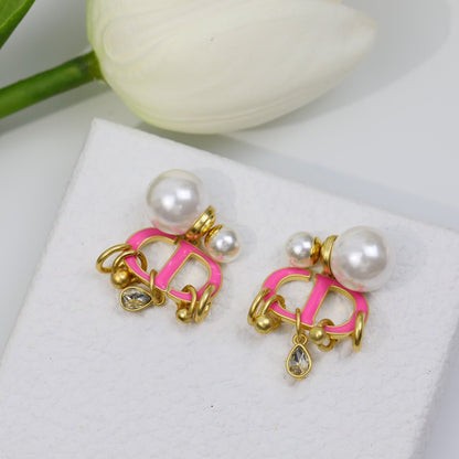 Boucles d'oreilles CD en or rose et perle avec 1 diamant