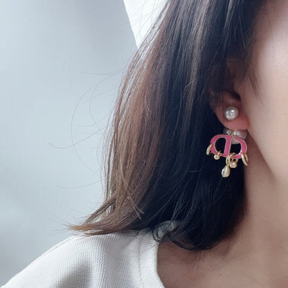 Boucles d'oreilles CD en or rose et perle avec 1 diamant