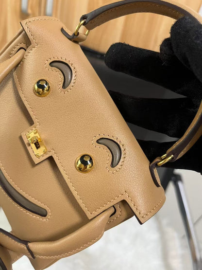 Poupée HM Kelly 16 cm en cuir Gulliver doré