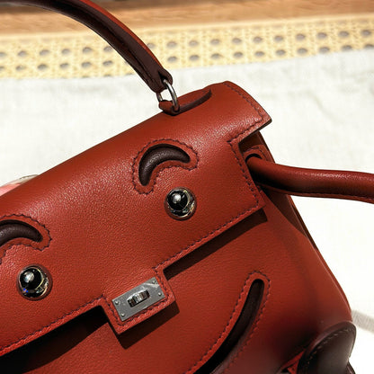 Poupée HM Kelly 16 cm en cuir Gulliver bordeaux