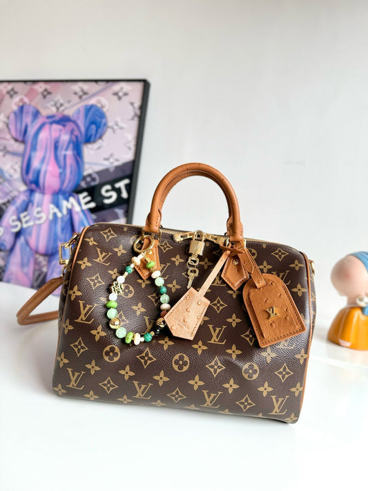 Sac LV Speedy Soft 30 Boho en toile marron monogrammée avec accessoires dorés