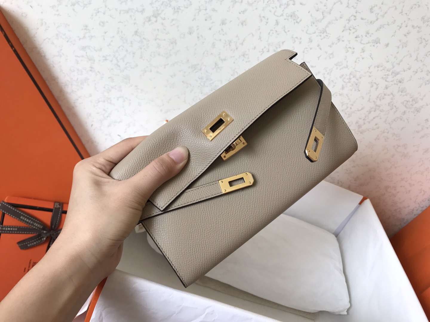Portefeuille long Kelly 20 cm en cuir Epsom gris