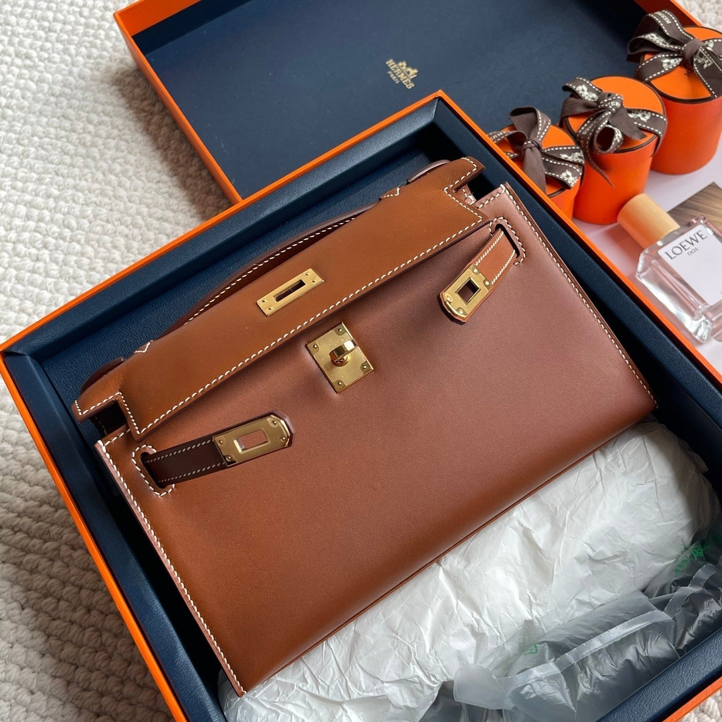 Pochette HM Kelly 22 cm marron foncé avec finitions dorées