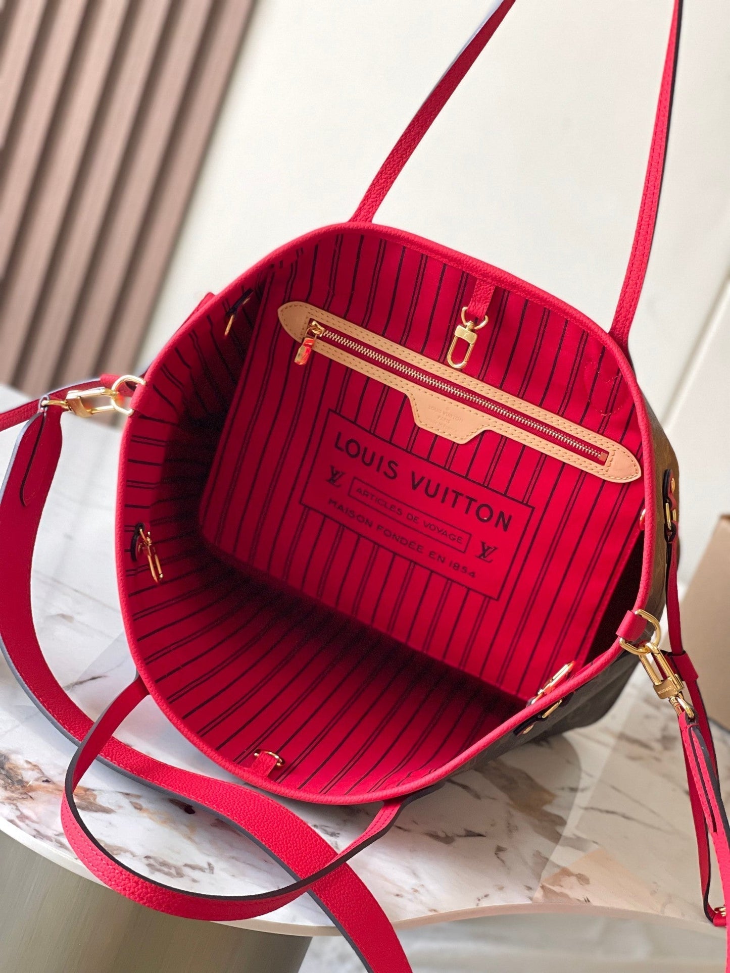 Réversible Neverfull MM 31 à l'envers avec poignée rouge 