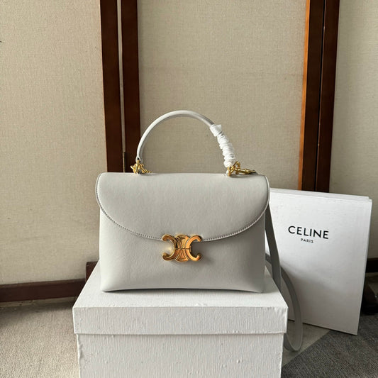 SAC NINO MOYEN 25 EN CUIR DE VEAU SOUPLE BLANC, QUINCAILLERIE DORÉE