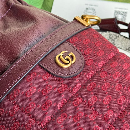 SAC SEAU 18 EN TOILE ROUGE BORDEAUX ET CUIR DE VEAU QUINCAILLERIE DORÉ