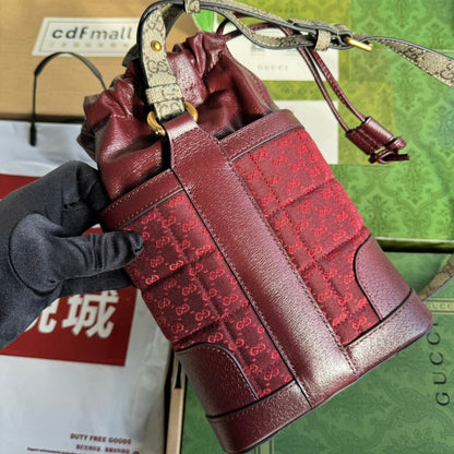 SAC SEAU 18 EN TOILE ROUGE BORDEAUX ET CUIR DE VEAU QUINCAILLERIE DORÉ