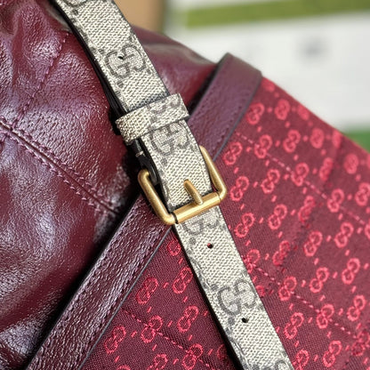 SAC SEAU 18 EN TOILE ROUGE BORDEAUX ET CUIR DE VEAU QUINCAILLERIE DORÉ