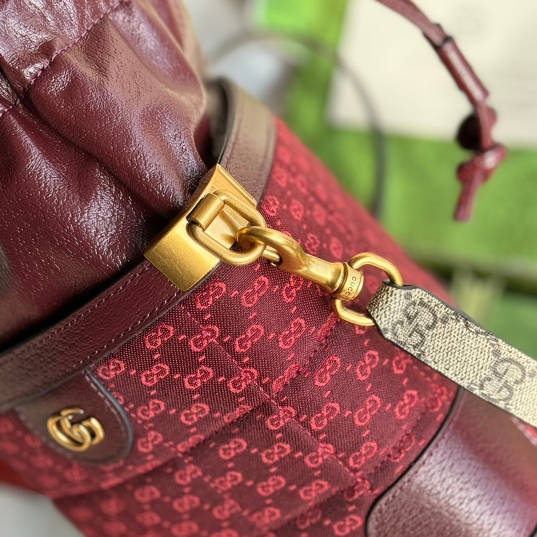 SAC SEAU 18 EN TOILE ROUGE BORDEAUX ET CUIR DE VEAU QUINCAILLERIE DORÉ