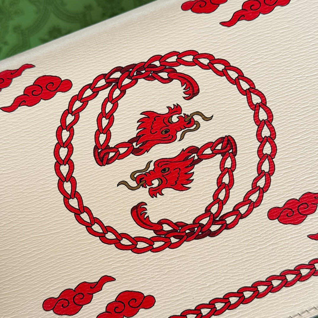 Petit sac bandoulière Dyonysus 25 en cuir de veau beige et rouge avec logo dragon imprimé