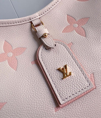 Sac fourre-tout PM 29 en cuir de vachette grainé rose clair avec monogramme 
