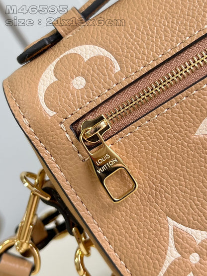 Pochette Metis East West 21,5 en cuir de veau monogrammé marron et blanc