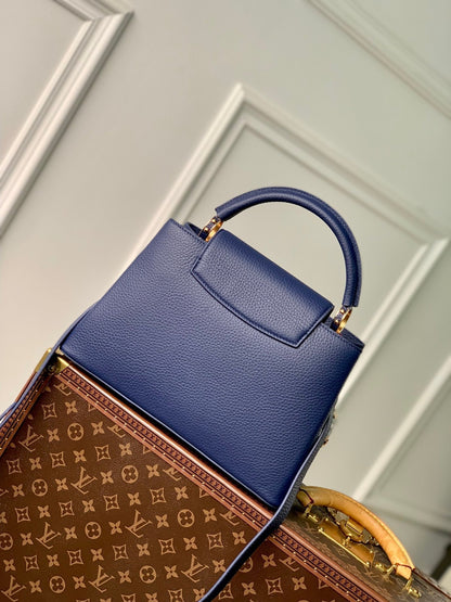 capucines mm 31,5 cuir taurillon bleu foncé accastillage doré