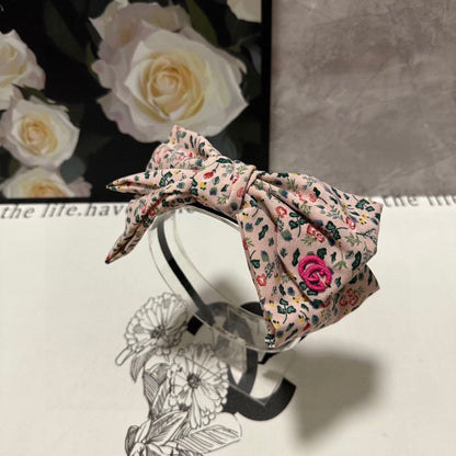 BANDEAU À CHEVEUX EN TISSU FLEURI ROSE CLAIR 385853