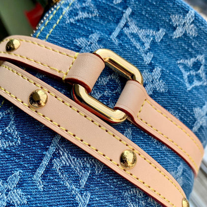 PAPILLON 27 EN DENIM MONOGRAMME BLEU, QUINCAILLERIE DORÉ