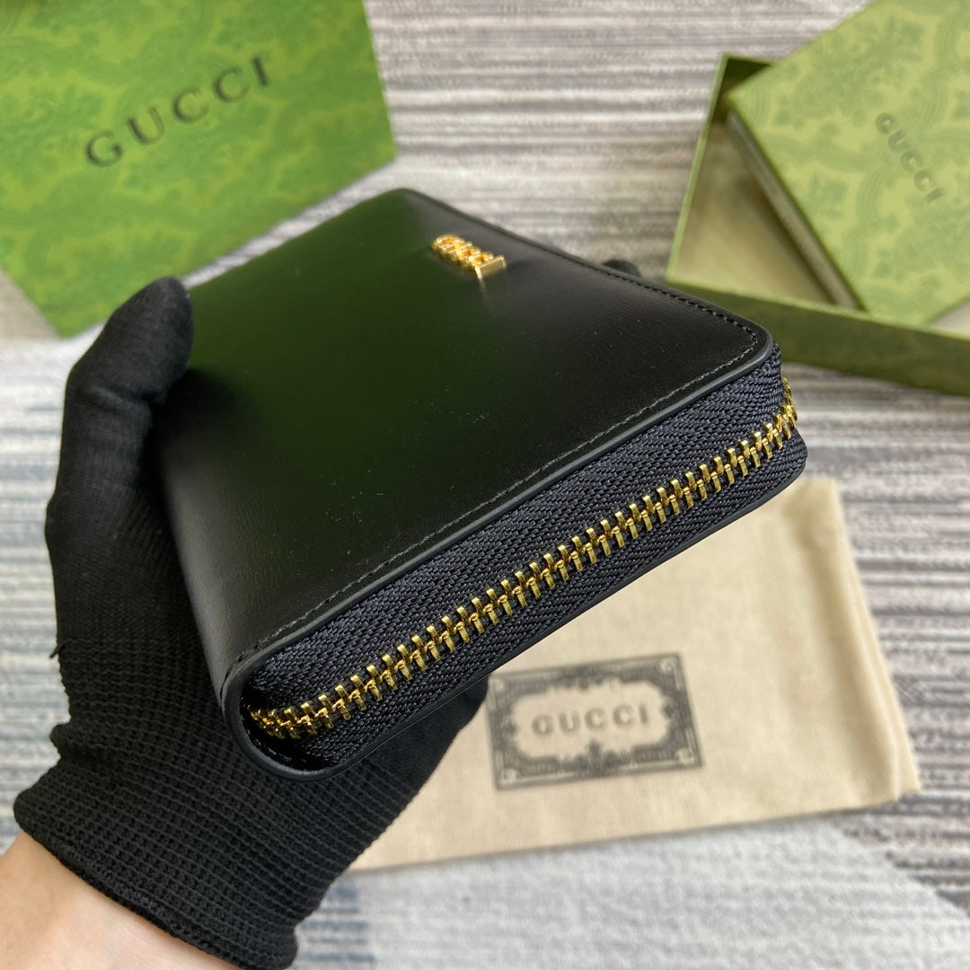 PORTEFEUILLE ZIPPÉ 20 EN CUIR DE VEAU NOIR QUINCAILLERIE DORÉ