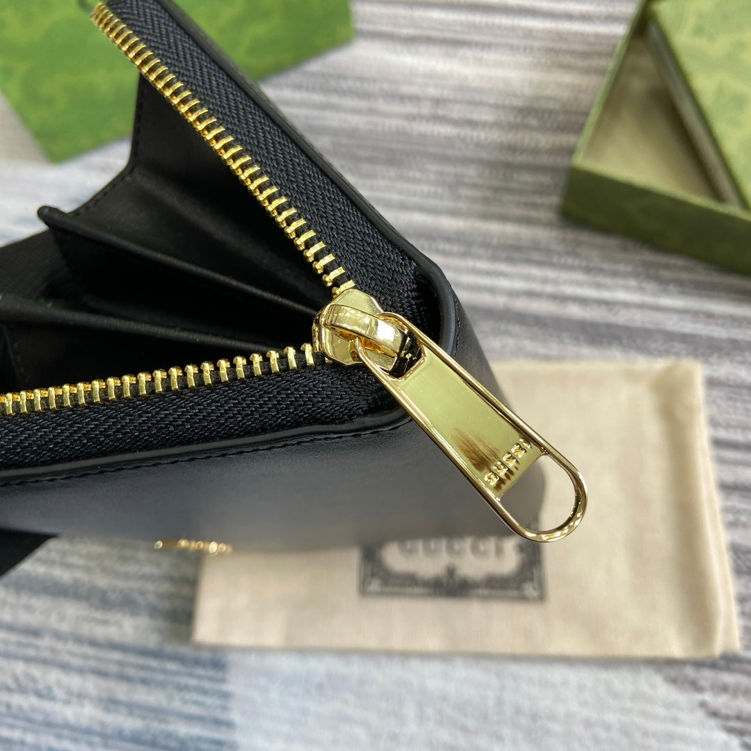 PORTEFEUILLE ZIPPÉ 20 EN CUIR DE VEAU NOIR QUINCAILLERIE DORÉ