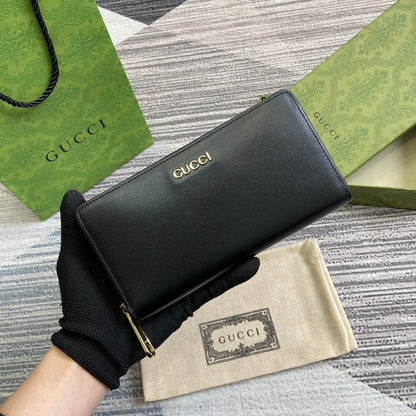 PORTEFEUILLE ZIPPÉ 20 EN CUIR DE VEAU NOIR QUINCAILLERIE DORÉ