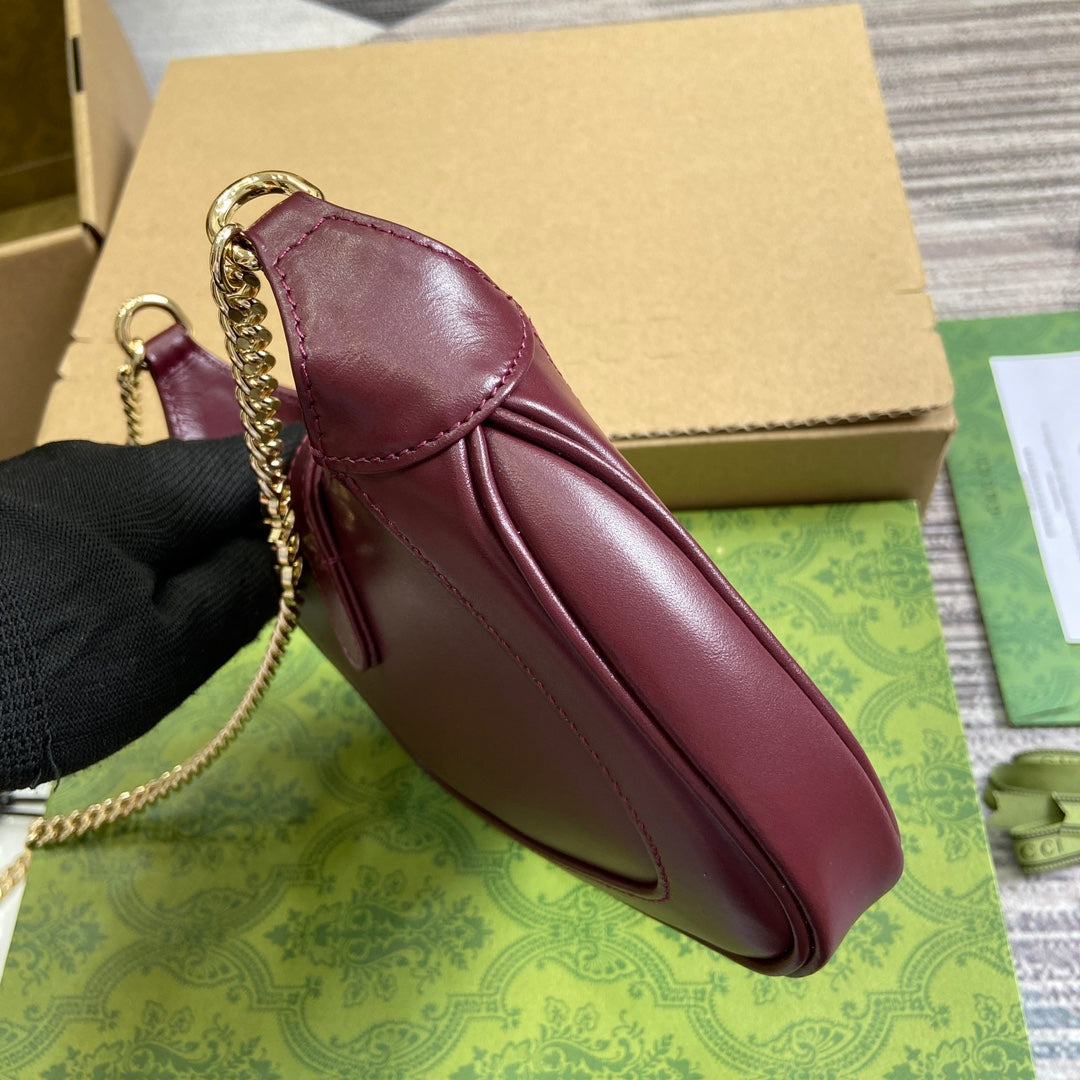 MINI SAC JACKIE NOTTE 19 EN CUIR DE VEAU ROUGE BORDEAUX, QUINCAILLERIE DORÉ