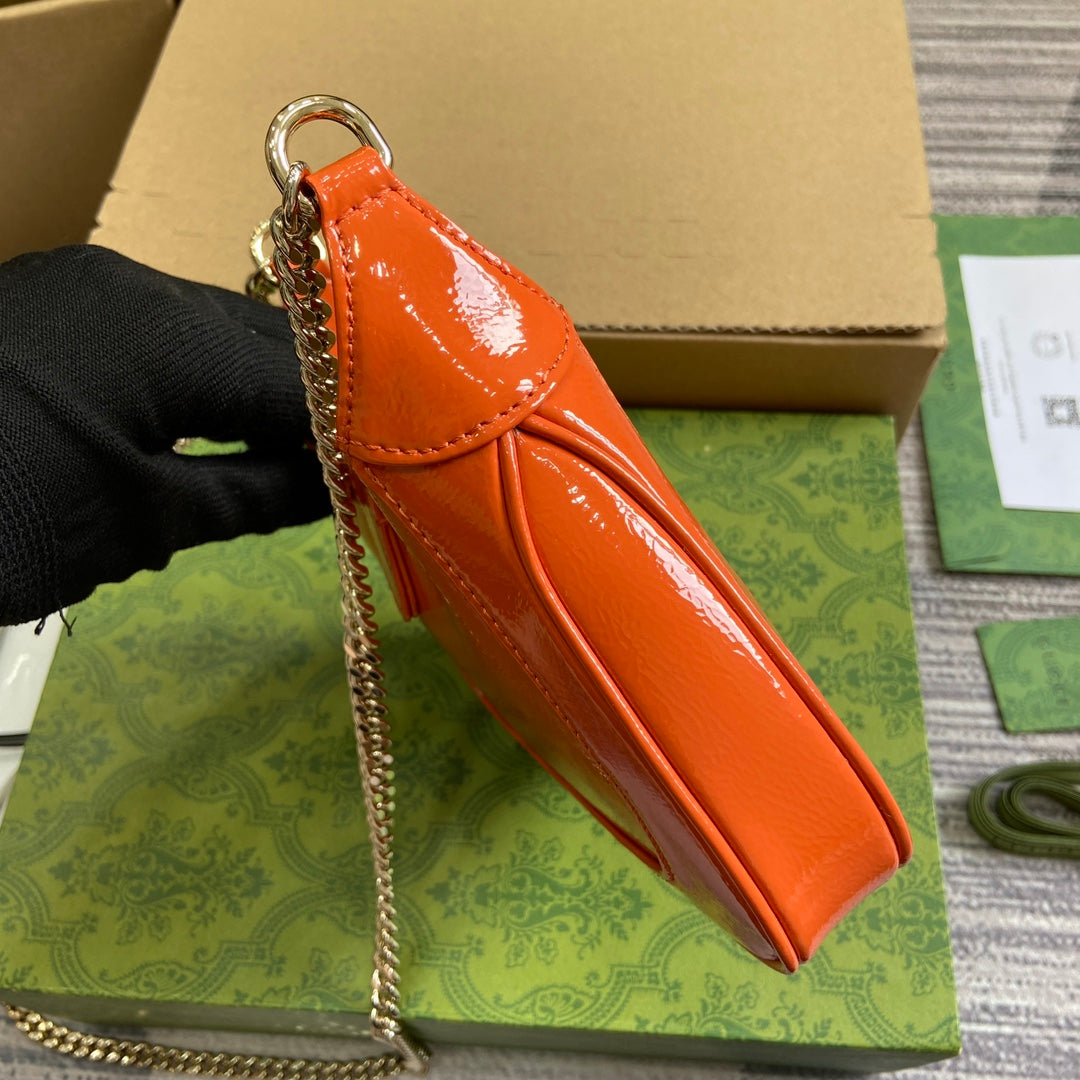 ジャッキー・ノッテ ミニバッグ 19インチ オレンジ クラックラッカーカーフスキン ゴールド金具
