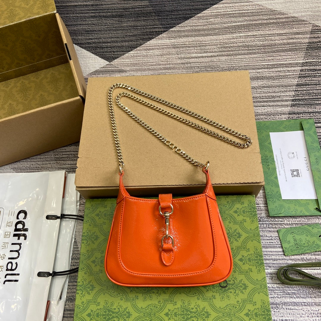 ジャッキー・ノッテ ミニバッグ 19インチ オレンジ クラックラッカーカーフスキン ゴールド金具