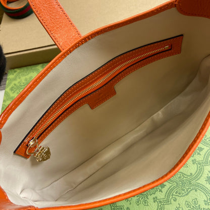 Petit sac bandoulière Jackie 27 en cuir de veau laqué craquelé orange, matériel doré 