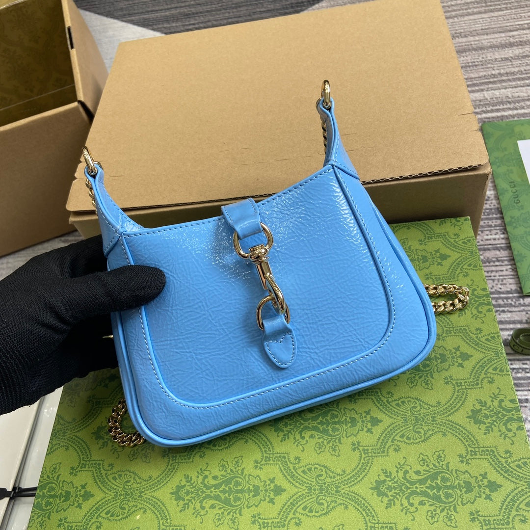 MINI SAC JACKIE NOTTE 19 EN CUIR DE VEAU LAQUÉ CRAQUELÉ BLEU OCÉAN, QUINCAILLERIE DORÉ