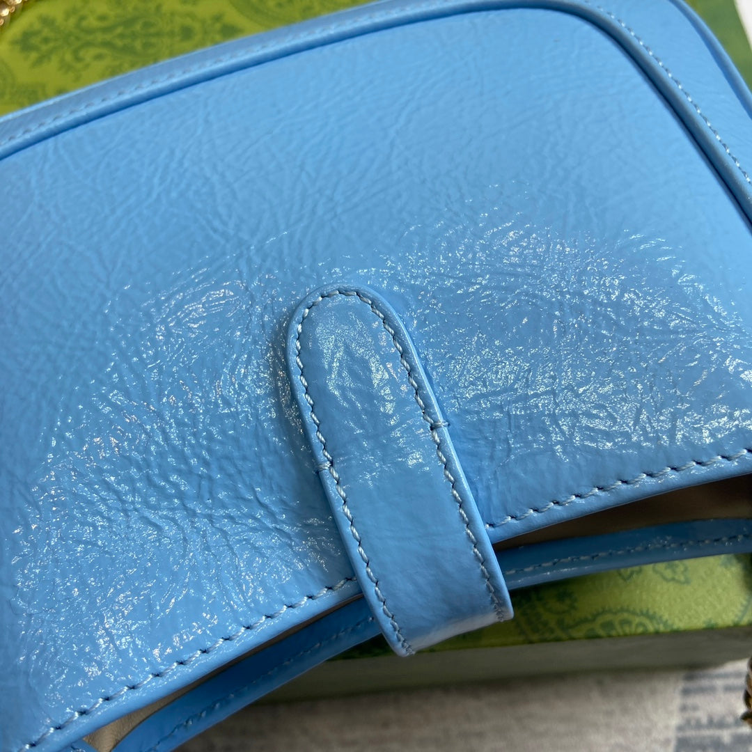 MINI SAC JACKIE NOTTE 19 EN CUIR DE VEAU LAQUÉ CRAQUELÉ BLEU OCÉAN, QUINCAILLERIE DORÉ