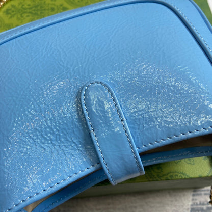 MINI SAC JACKIE NOTTE 19 EN CUIR DE VEAU LAQUÉ CRAQUELÉ BLEU OCÉAN, QUINCAILLERIE DORÉ