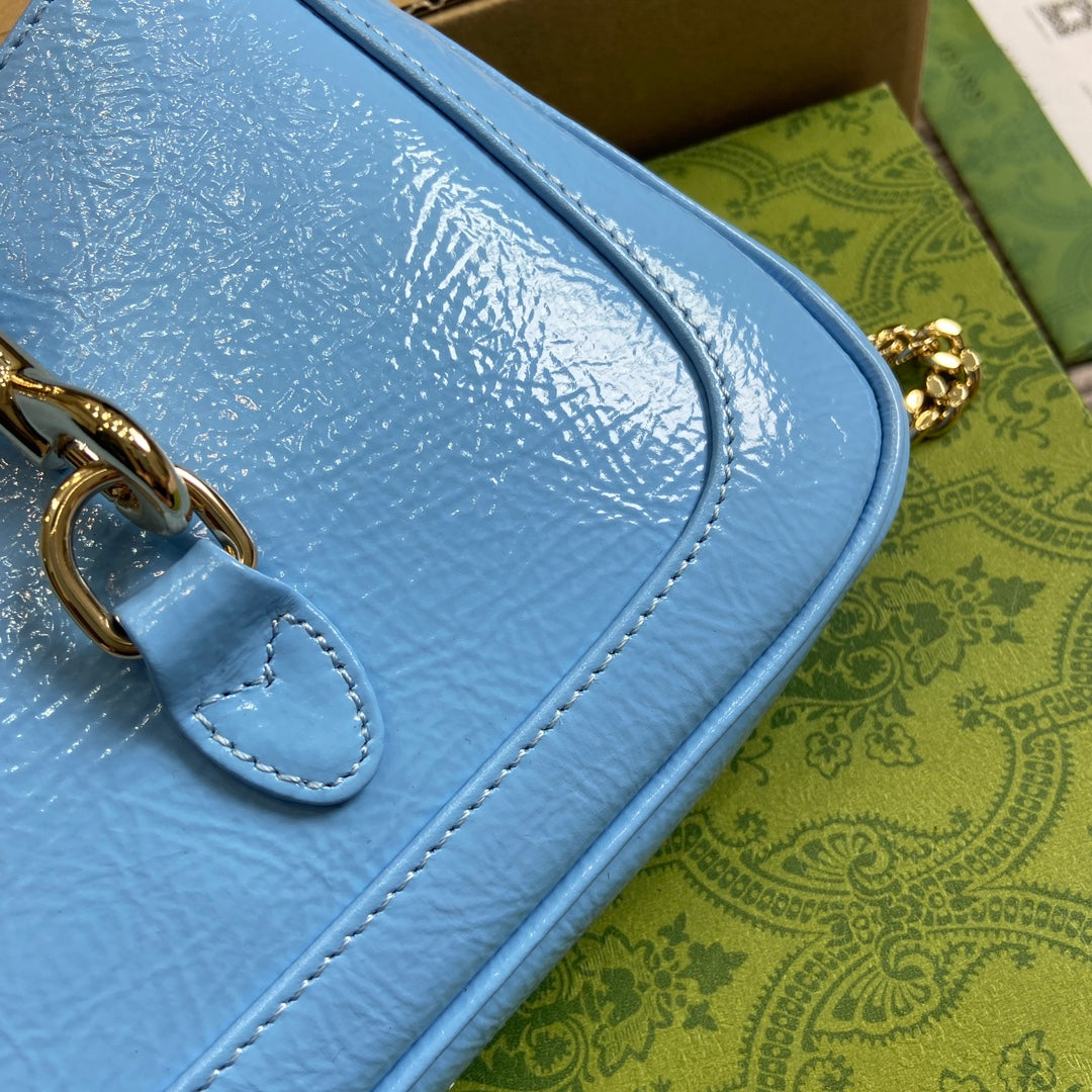 MINI SAC JACKIE NOTTE 19 EN CUIR DE VEAU LAQUÉ CRAQUELÉ BLEU OCÉAN, QUINCAILLERIE DORÉ