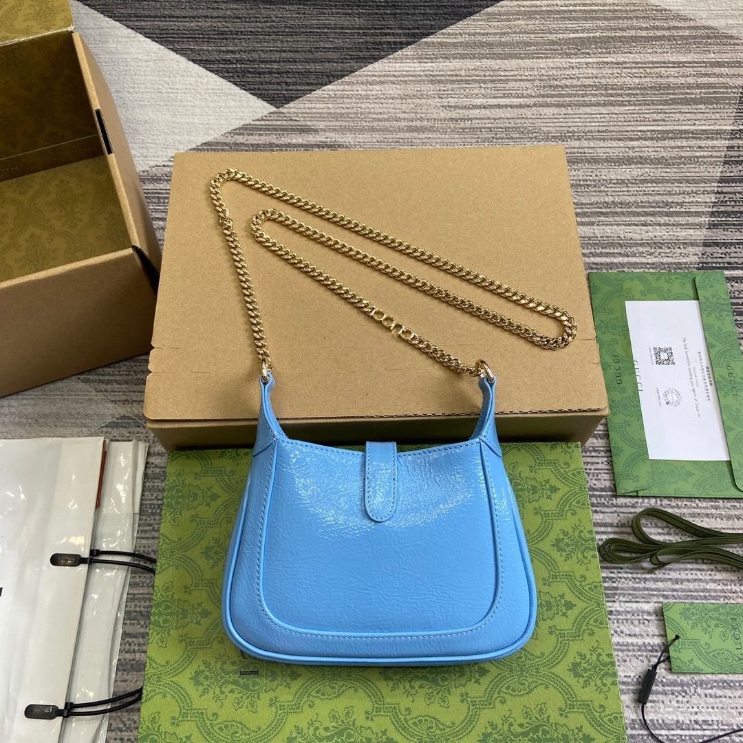 MINI SAC JACKIE NOTTE 19 EN CUIR DE VEAU LAQUÉ CRAQUELÉ BLEU OCÉAN, QUINCAILLERIE DORÉ