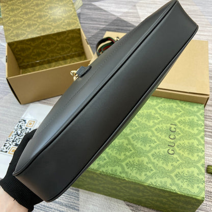 Sac bandoulière Jackie Medium 35 en cuir de veau noir et métal doré 