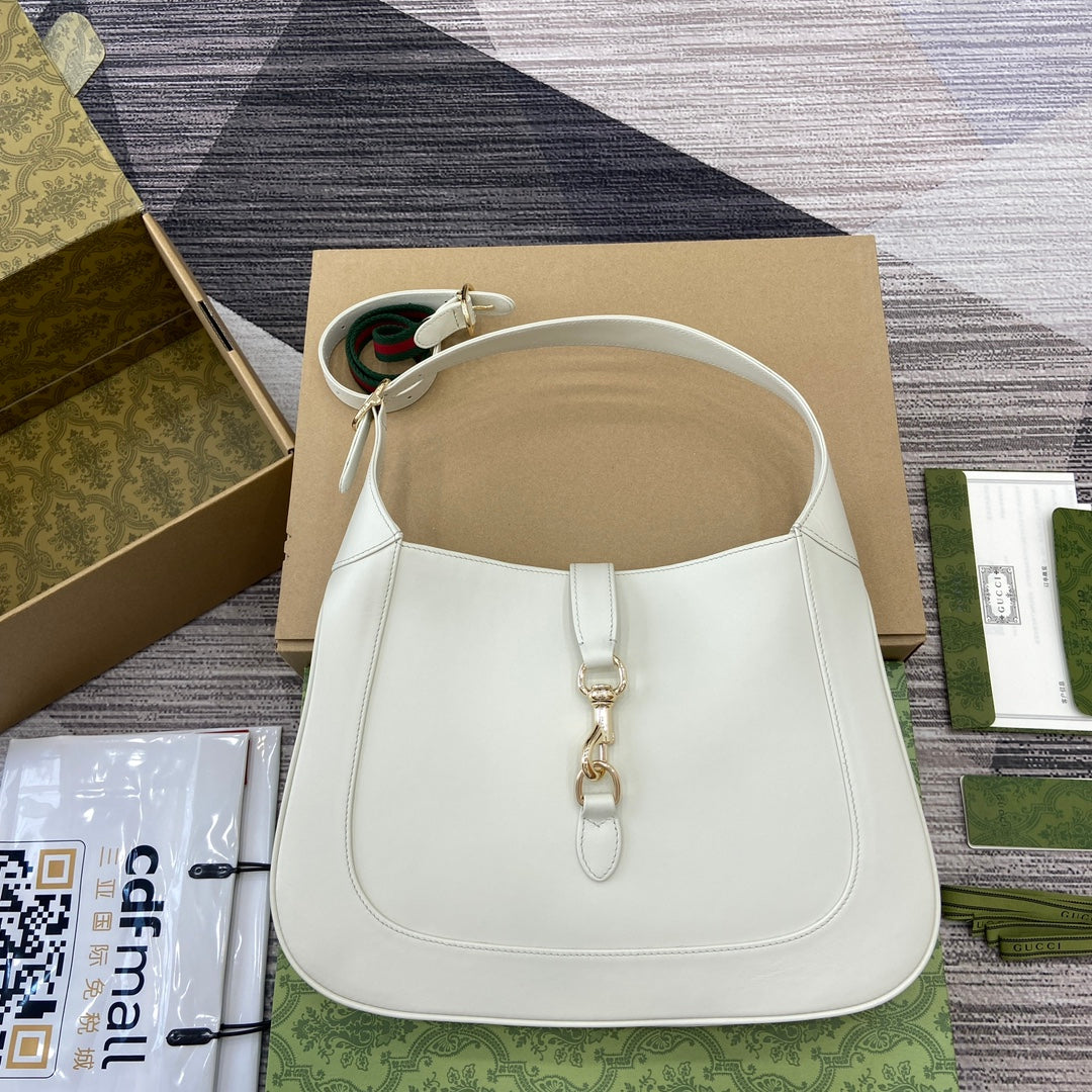Sac bandoulière Jackie Medium 35 en cuir de veau blanc et métal doré 