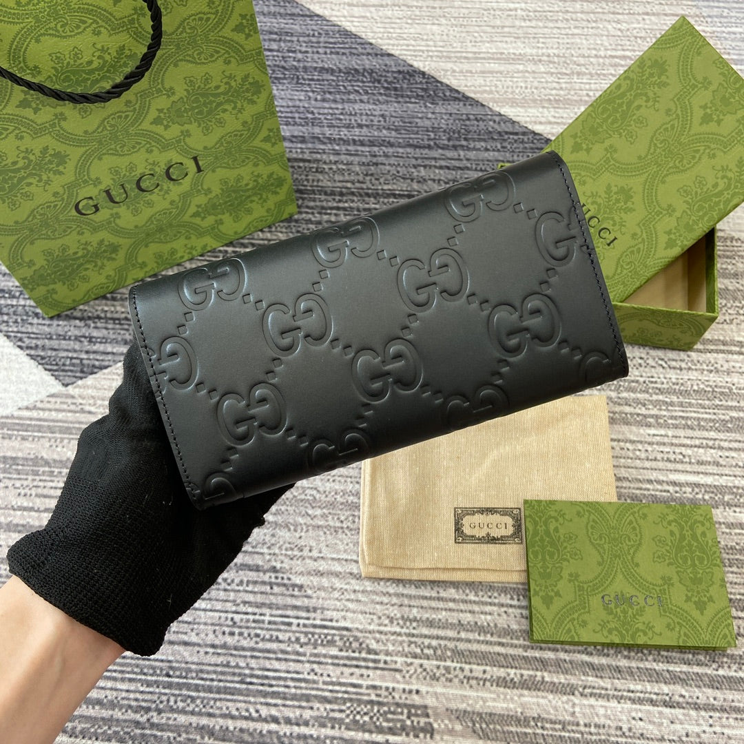 Portefeuille continental 19 en cuir de veau embossé noir, matériel doré
