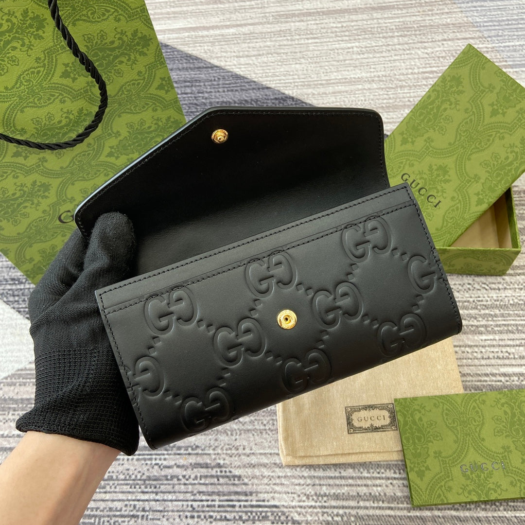 Portefeuille continental 19 en cuir de veau embossé noir, matériel doré