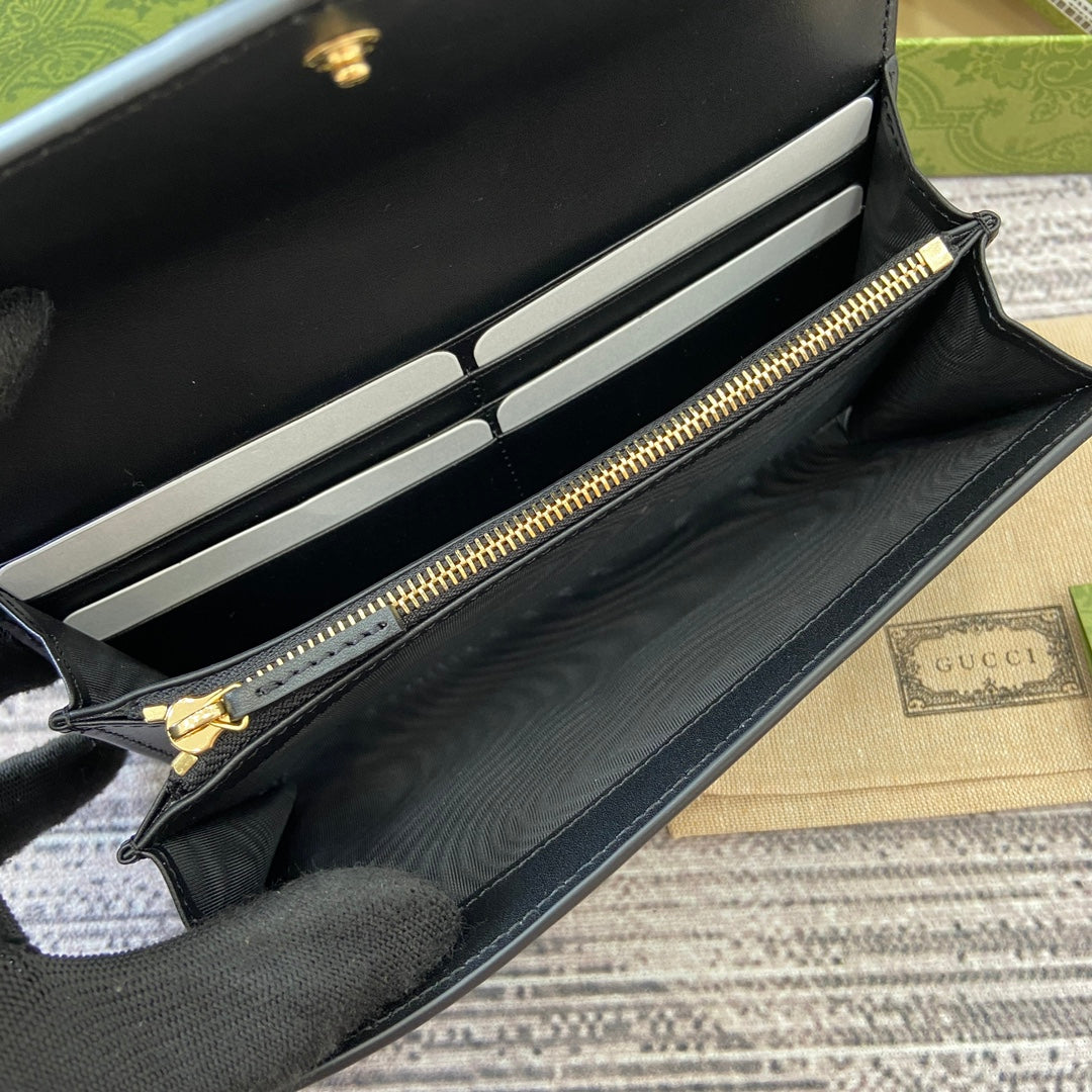Portefeuille continental 19 en cuir de veau embossé noir, matériel doré
