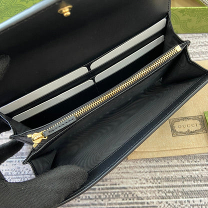 Portefeuille continental 19 en cuir de veau embossé noir, matériel doré