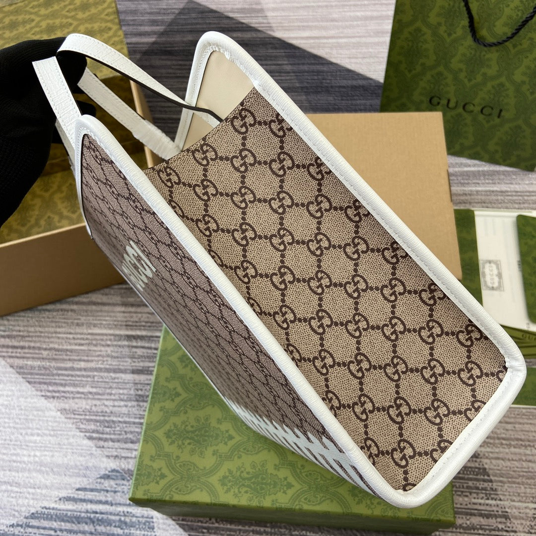 SAC CABAS 28 IMPRIMÉ ANIMALIER EN TOILE BEIGE ET BORDURE EN CUIR DE VEAU BLANC
