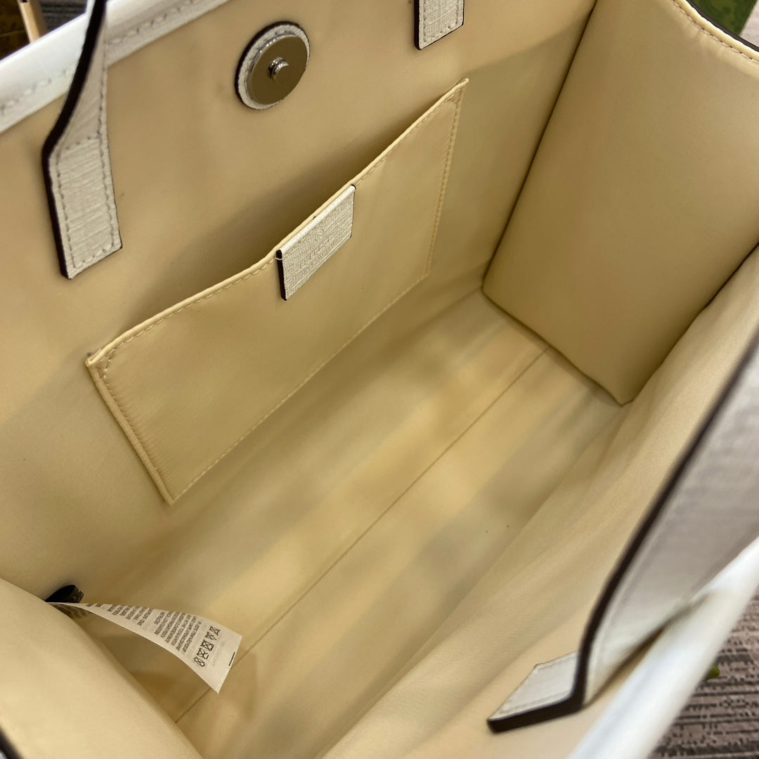 SAC CABAS 28 IMPRIMÉ ANIMALIER EN TOILE BEIGE ET BORDURE EN CUIR DE VEAU BLANC