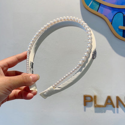 Bandeau en coton blanc avec chaîne de perles attachée 418900