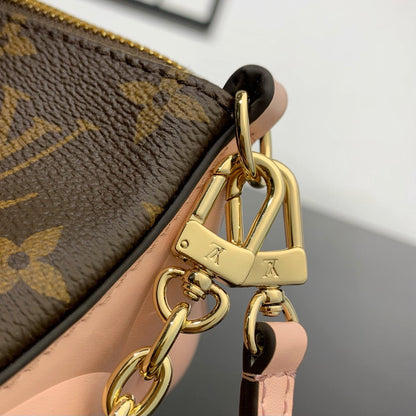Pochette Bloom 22 en toile monogrammée marron et côtés en cuir de veau rose pastel