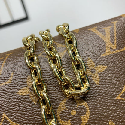 Pochette Bloom 22 en toile monogrammée marron et côtés en cuir de veau rose pastel