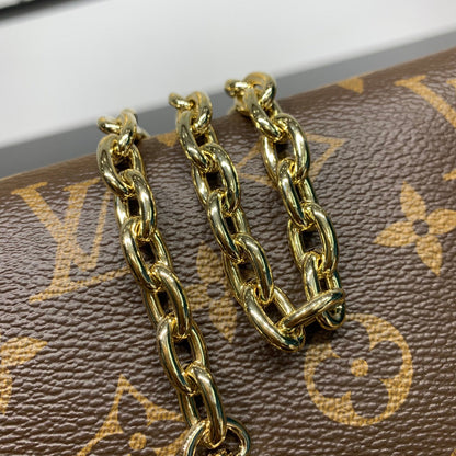 POCHETTE BLOOM 22 EN TOILE MONOGRAMME MARRON ET CÔTÉS EN CUIR DE VEAU JAUNE PASTEL
