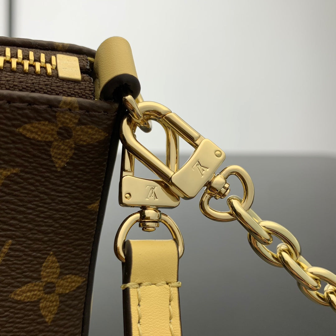 POCHETTE BLOOM 22 EN TOILE MONOGRAMME MARRON ET CÔTÉS EN CUIR DE VEAU JAUNE PASTEL