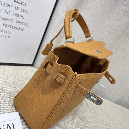 Sac à main HM Kelly 25 cm en cuir Togo marron avec accessoires argentés