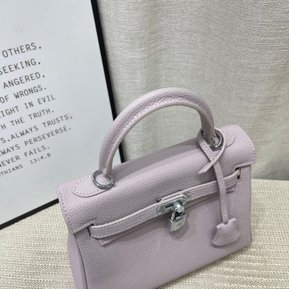 Sac à main HM Kelly 25 cm en cuir Togo mauve rose pâle et accessoires argentés